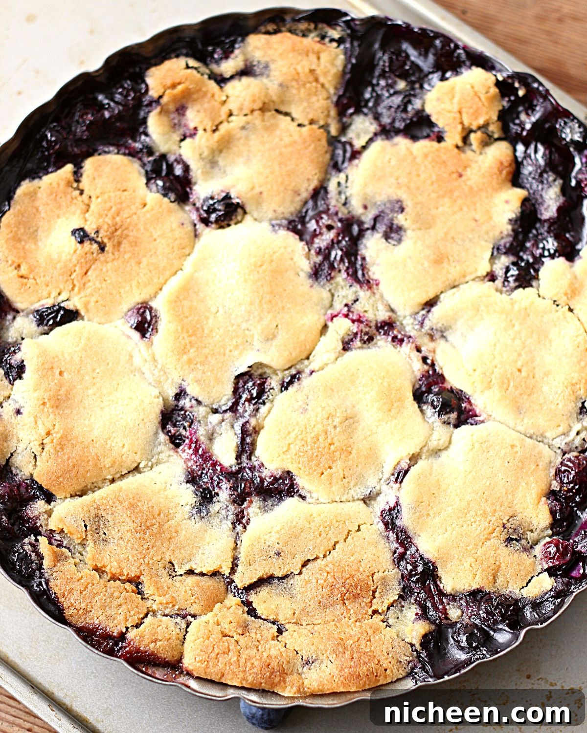 Blueberry Cobbler with Cookie Dough Crust Recipe 3 Pie plate full of fresh baked blueberry cobbler.