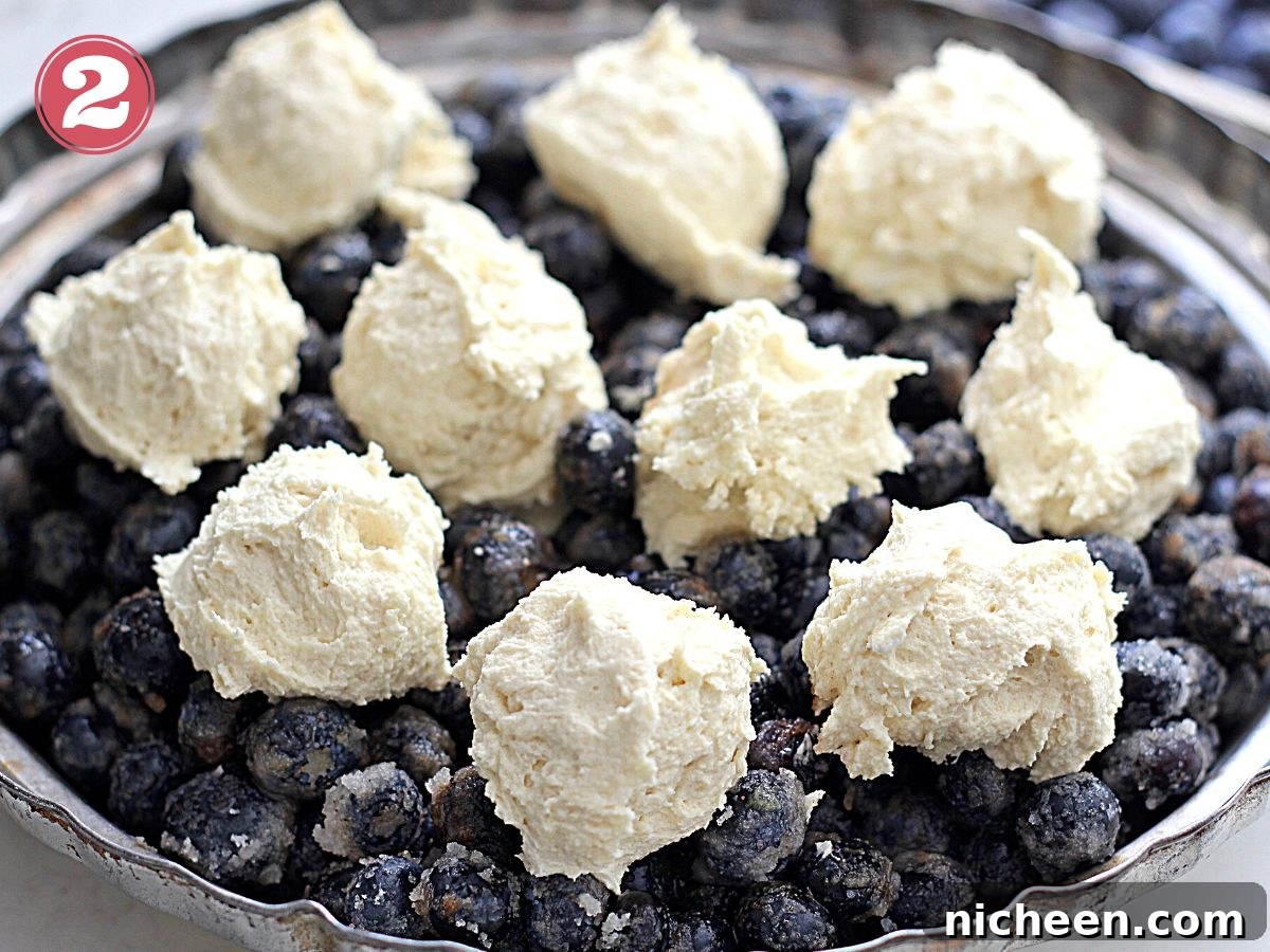 Blueberry Cobbler with Cookie Dough Crust Recipe 5 Blueberry Cobbler with cookie dough on top.