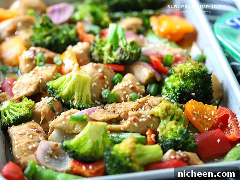 Try this easy Sheet Pan Sesame Chicken and Veggies tonight! Tender chicken is marinated in a delicious Sesame sauce and baked to perfection in 30 minutes. You and your family are going to love this simple recipe. 