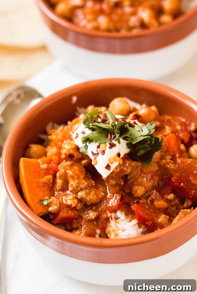 Instant Pot Turkey Chili in a bowl with garnish on top. 