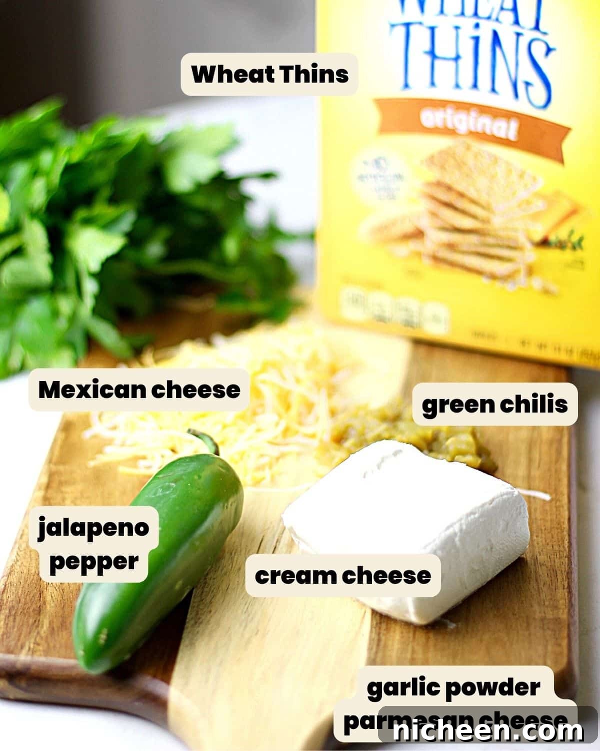 Crispy Jalapeno Popper Toppers Recipe 3 Ingredients on a cutting board to make crackers topped with jalapeno and cheese.