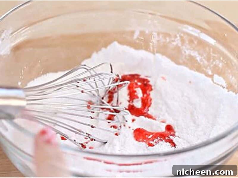 Bowl containing wet and dry ingredients to make a bath bomb.
