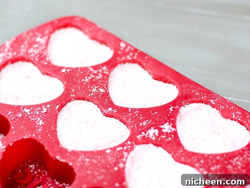 Red Heart shaped mold for making bath bombs.