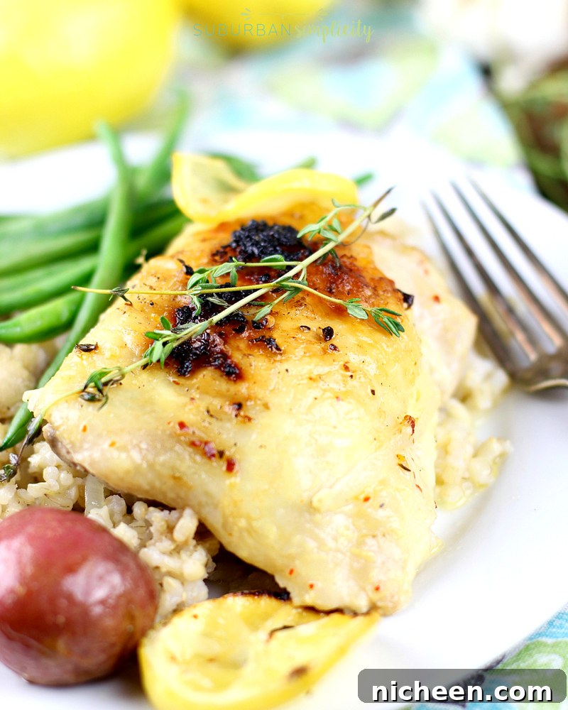 Oven-Baked Lemon Chicken Recipe: Crispy, Tender 5 Lemon chicken on a plate with green beans and roasted potatoes.