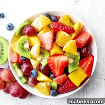 31 No-Sandwich Lunch Ideas Kids Will Love 7 Fruit salad in a white bowl.