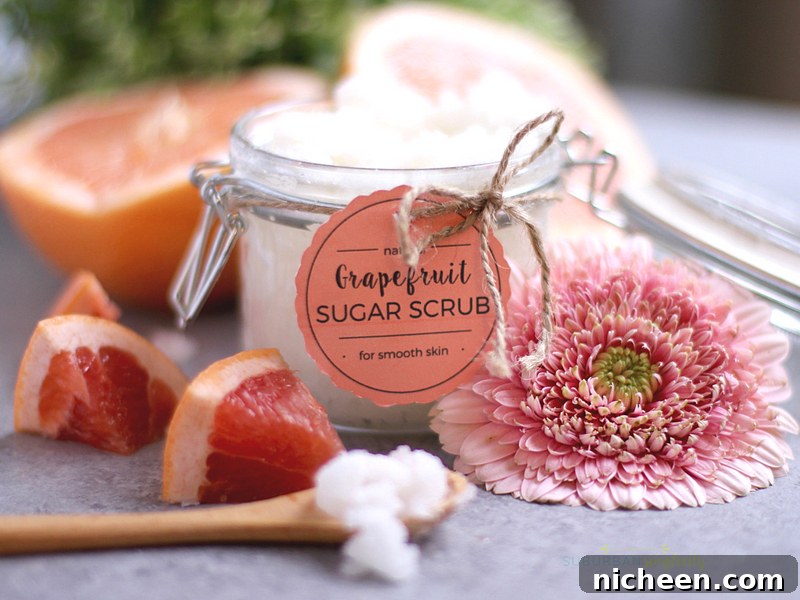 DIY Grapefruit Sugar Scrub Recipe for Radiant Skin 2 A freshly made jar of grapefruit sugar scrub with fresh grapefruit next to it.