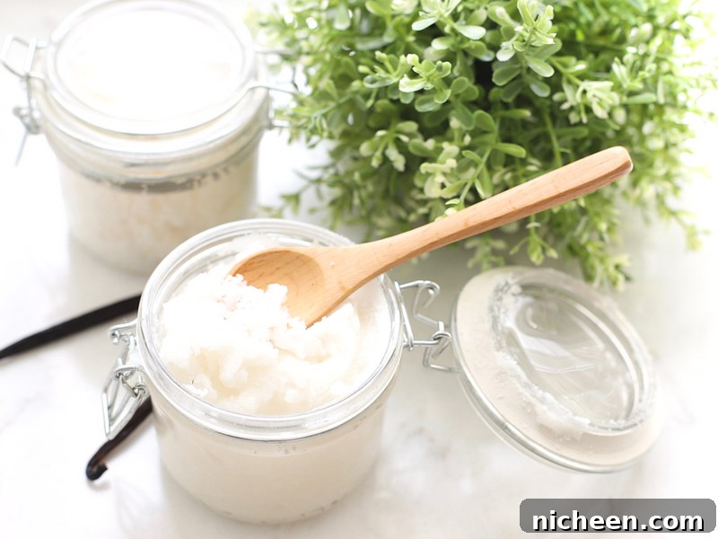 Homemade Vanilla Sugar Scrub and Free Printable Labels 4 Jar of vanilla sugar scrub with a spoon sticking out.