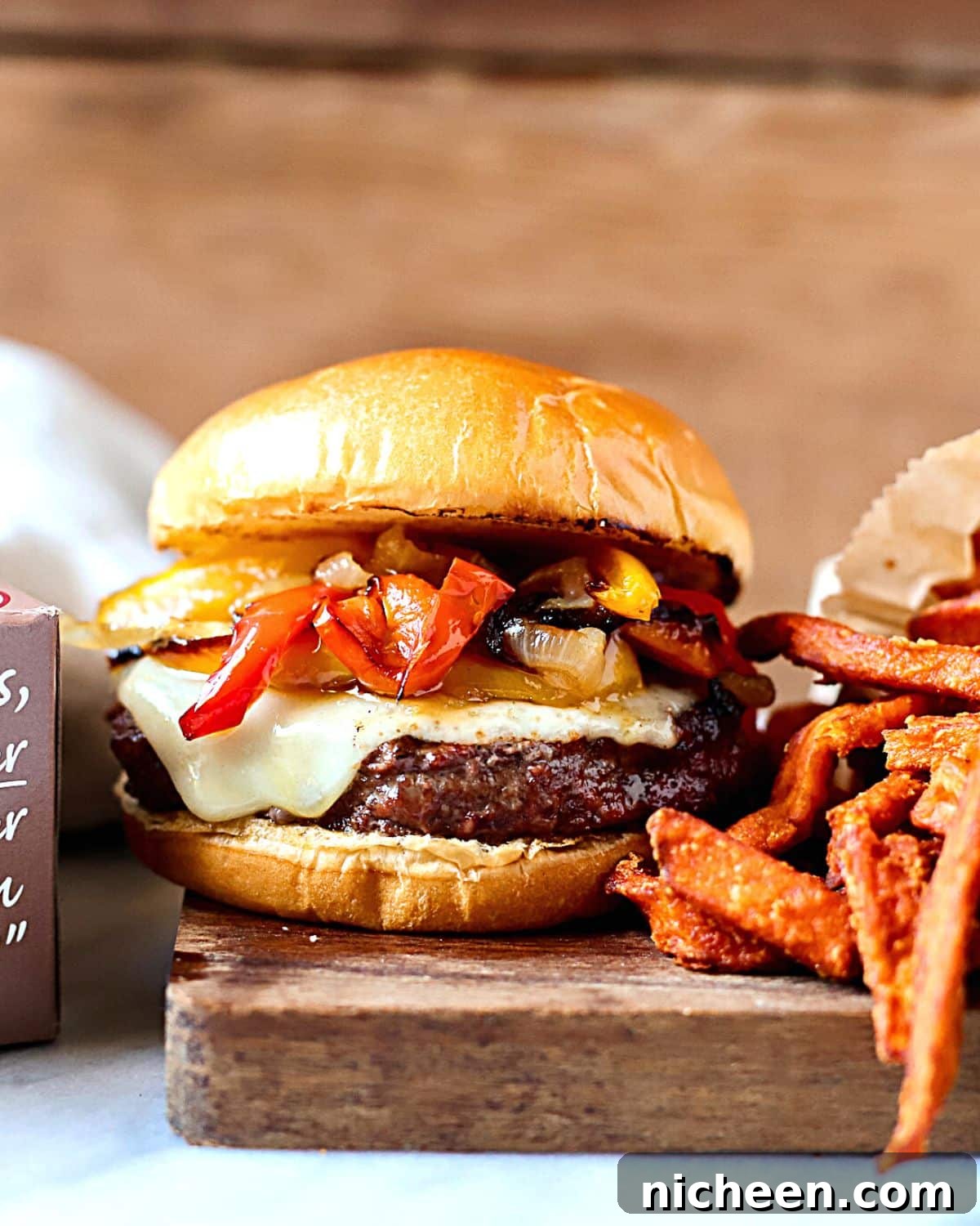 Homemade Philly Cheesesteak Burger Recipe 3 Burger topped with cheese, onions and peppers.