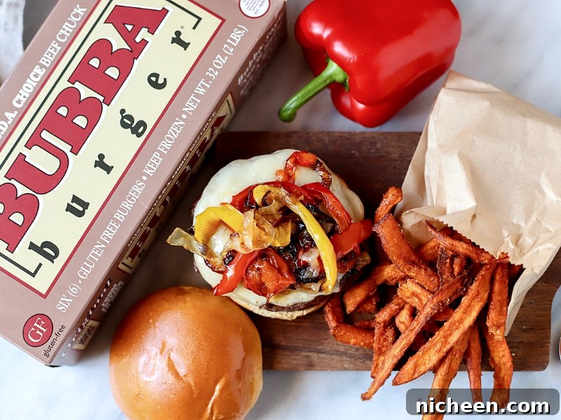 Homemade Philly Cheesesteak Burger Recipe 6 Open-face burger topped with cheese and onions.