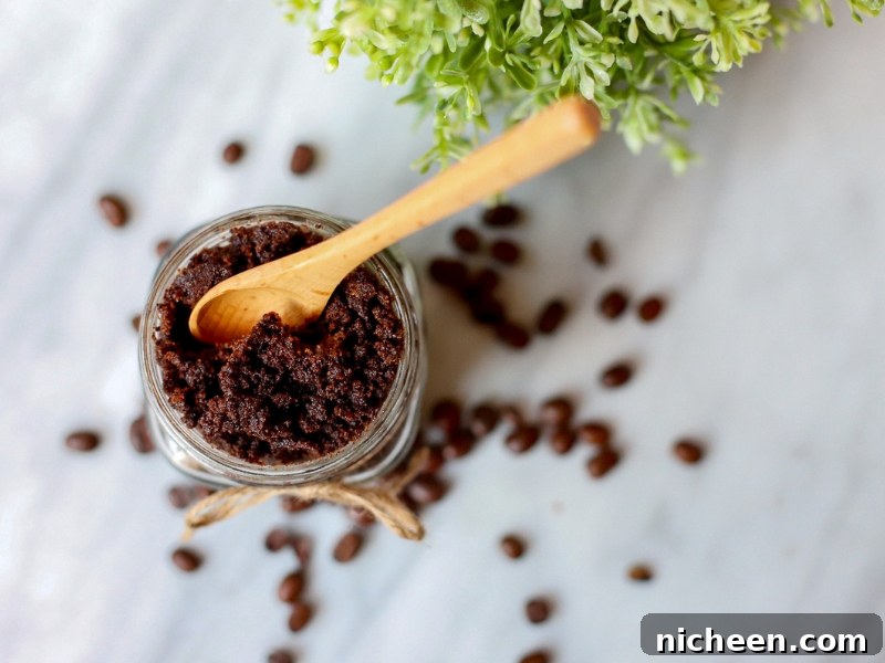 DIY Coffee Sugar Scrub Recipe for Glowing Skin 6 Coffee Sugar Scrub with wooden spoon sticking out.