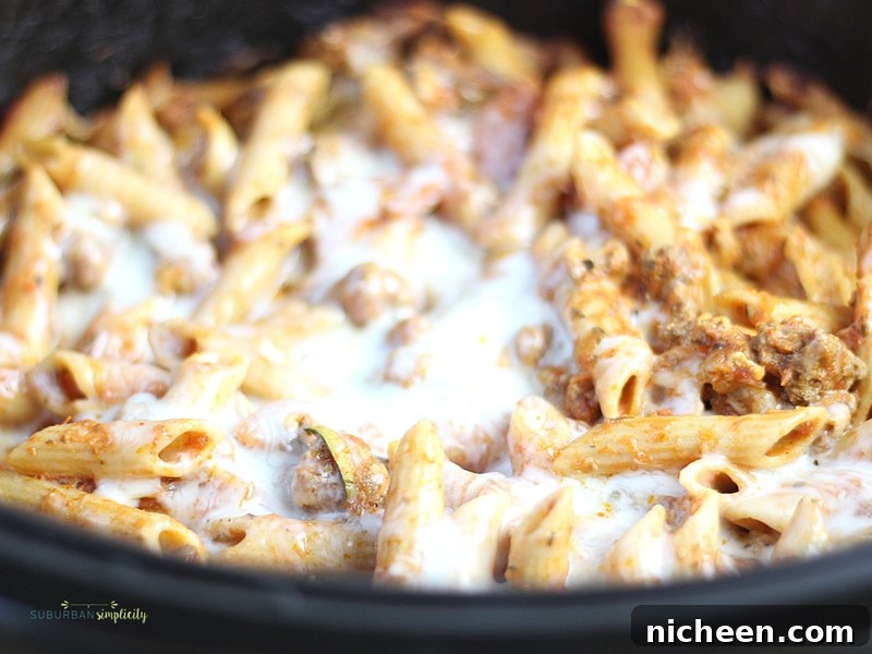 Crockpot Pizza Casserole is an easy weeknight dinner everyone LOVES! Simple and delicious every time. It's even great leftover for lunch the next day!