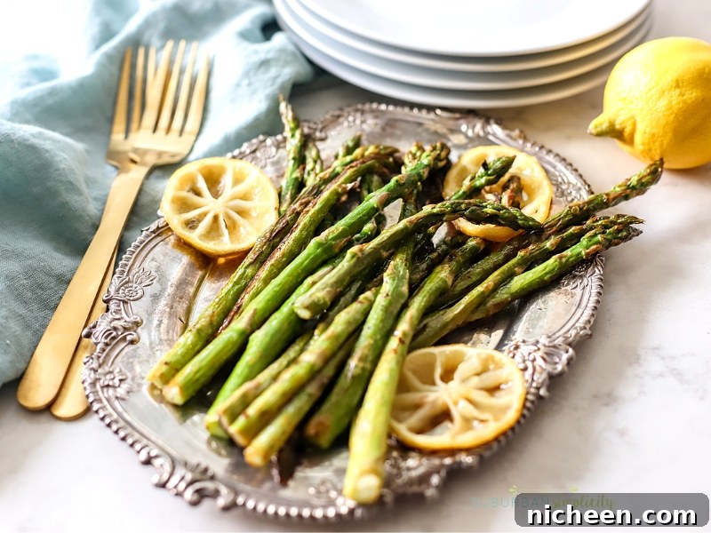 Crispy Oven-Roasted Asparagus Recipe for Easter or Anytime 2 Roasted Asparagus with Lemon on a serving dish.