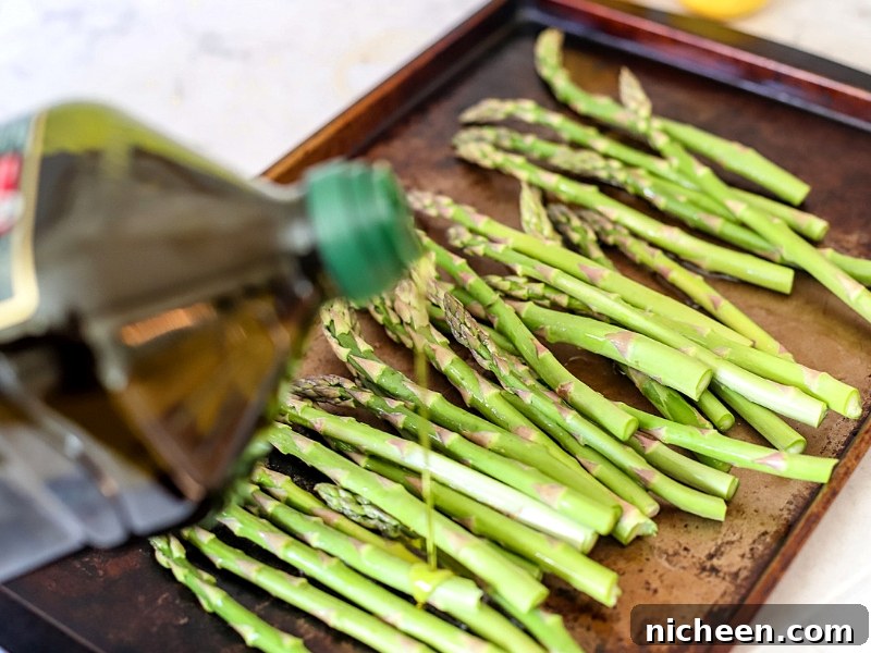 Crispy Oven-Roasted Asparagus Recipe for Easter or Anytime 4 Roasted asparagus being prepped for the oven.