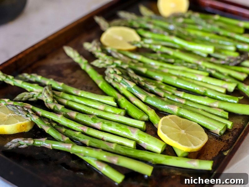 Crispy Oven-Roasted Asparagus Recipe for Easter or Anytime 5 Oven Roasting pan full of asparagus.