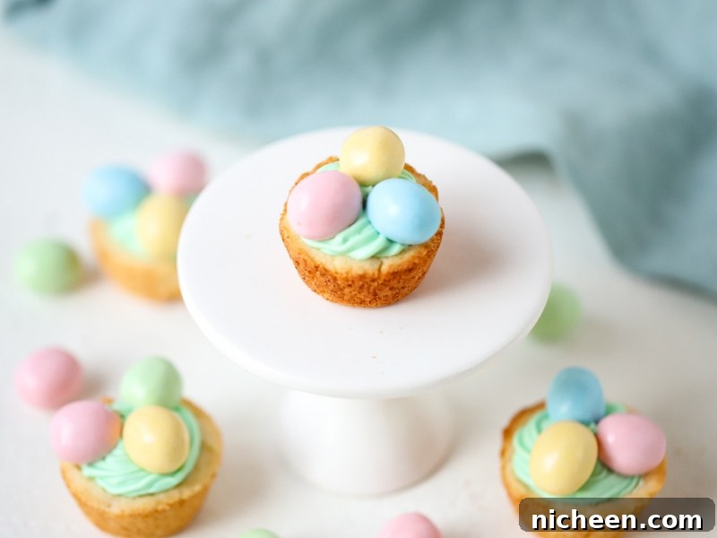 Adorable Easter Cookie Cups on a cake stand.