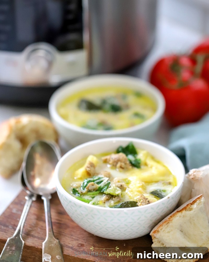 Two bowls of Instant Pot Tortellini Soup.