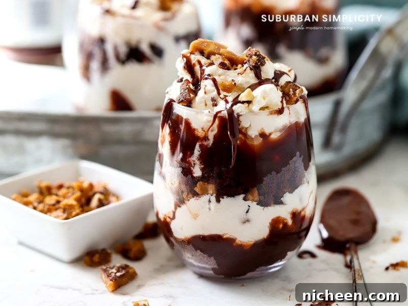 A chocolate toffee trifle in a glass with toffee bits