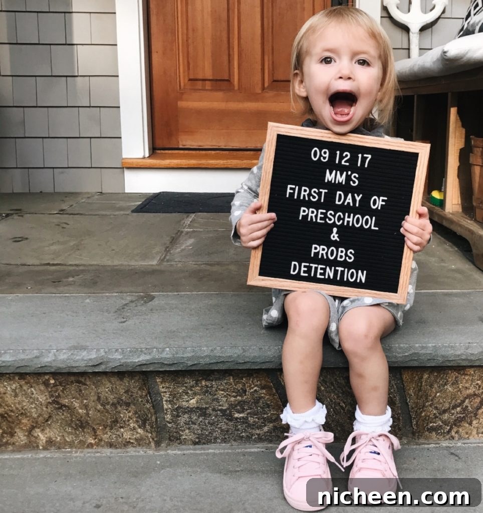 17 First Day of School Photo Ideas and Poses 8 A young child holding a sign