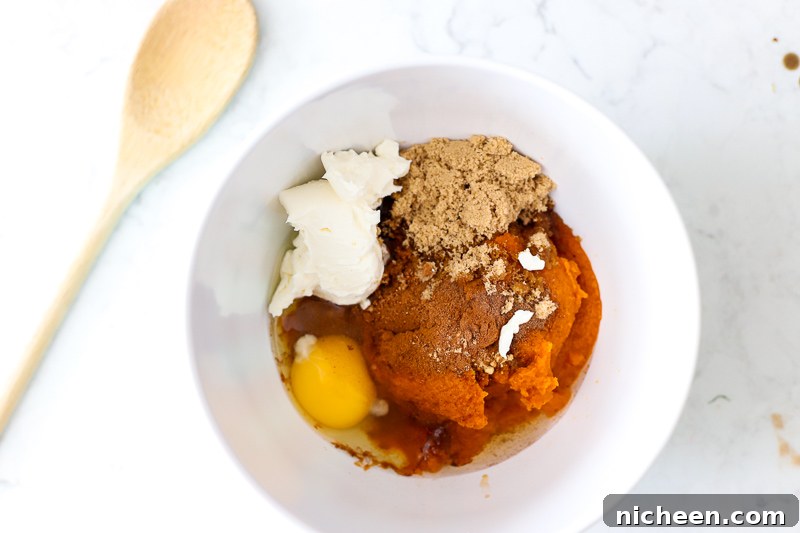 Ingredients in a bowl for pumpkin pie bombs