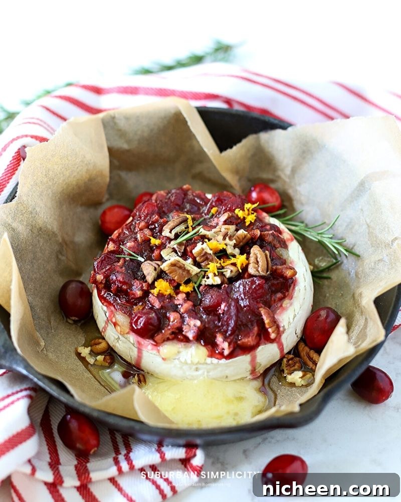 Cranberry Baked Brie in a cast iron skillet