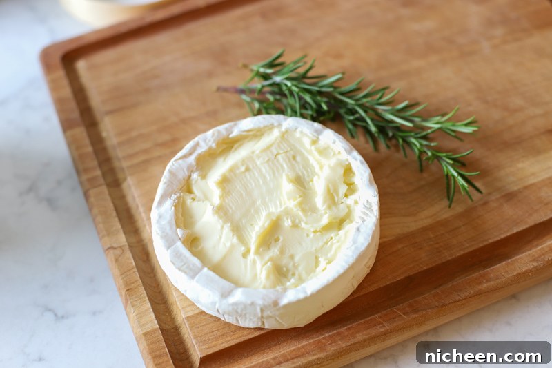 Brie cheese on cutting board
