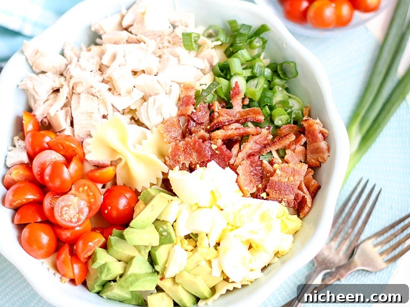 How to Cook Bacon in the Oven for Crispy, Evenly Cooked Strips 4 Ingredients for a Cobb Pasta Salad in a bowl.