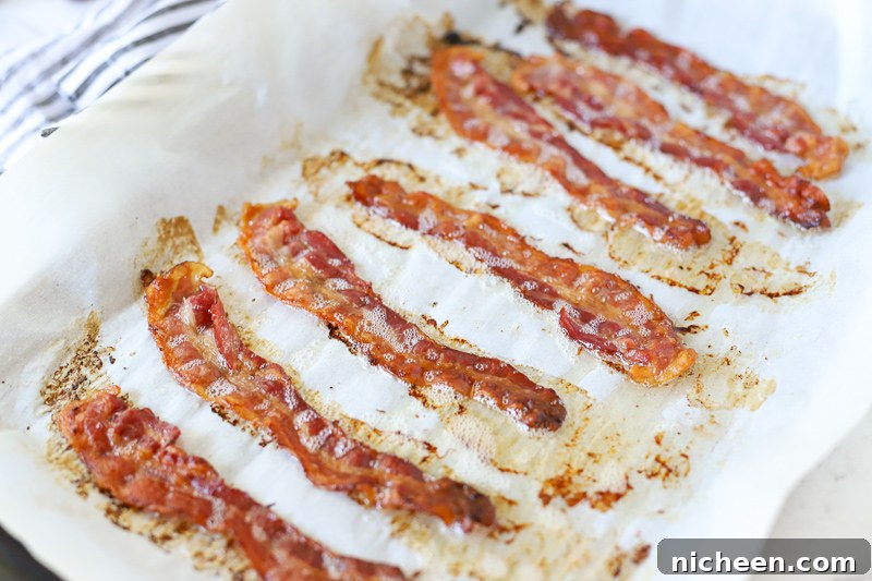 How to Cook Bacon in the Oven for Crispy, Evenly Cooked Strips 6 cooked bacon on a baking sheet