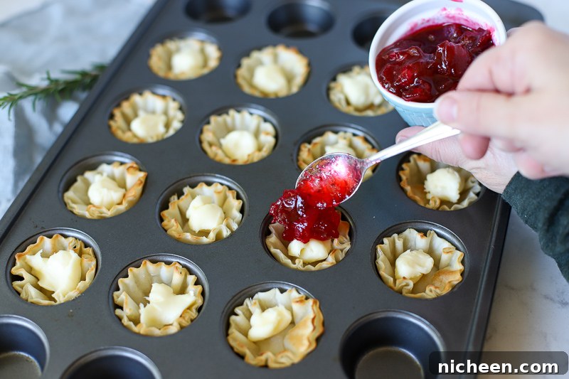 Brie Bite being filled with cranberries