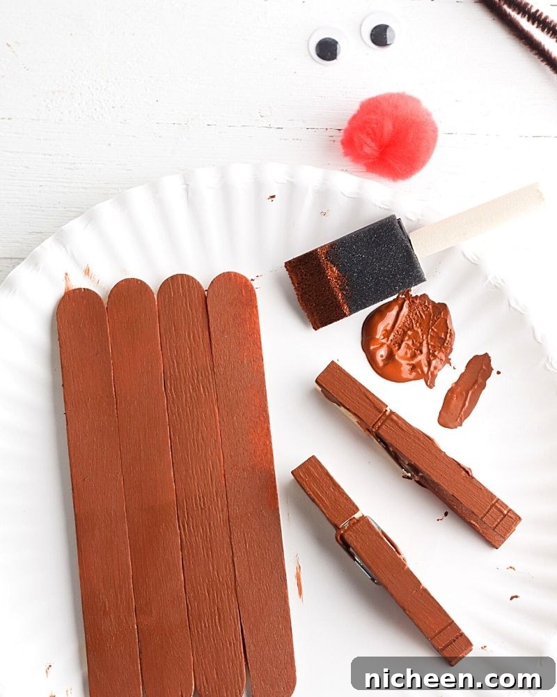 DIY Reindeer Crafts for Kids 5 Popsicle sticks painted brown