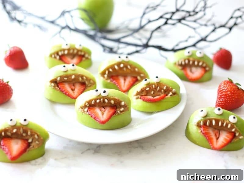 Apple Monster Mouths: Halloween Snack Recipe 7 Apple mouths with teeth on a plate
