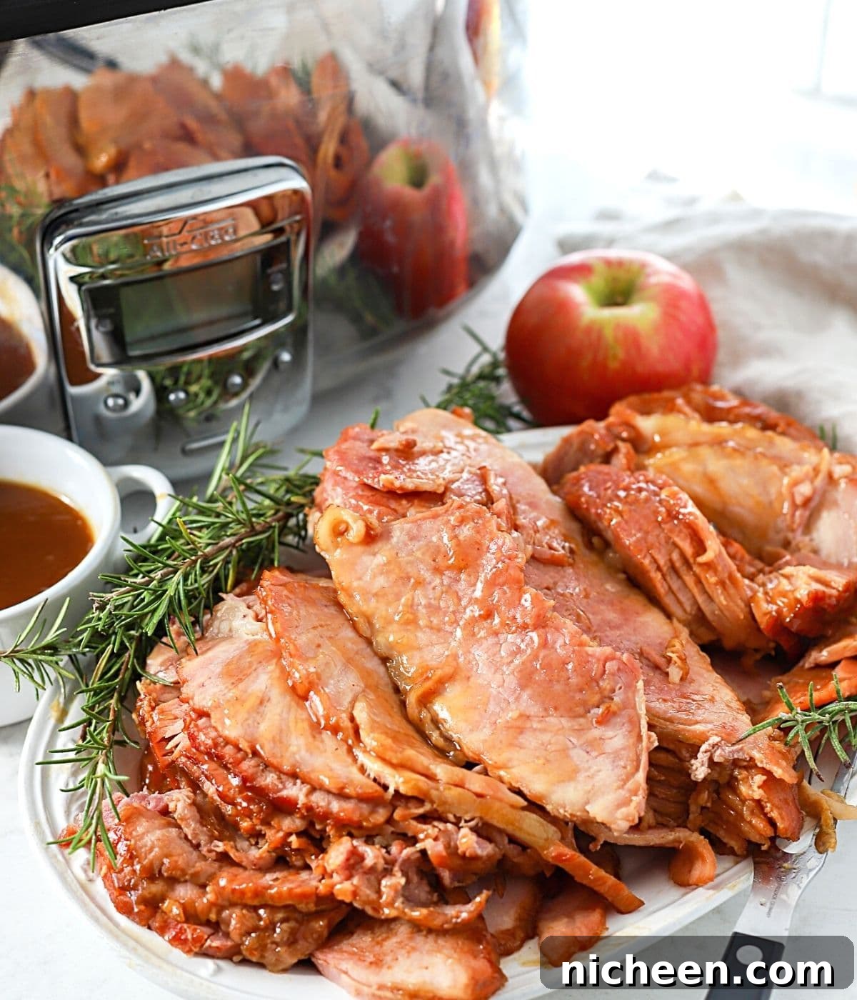 Glazed Crock-Pot Ham: Slow-Cooker Recipe for Tender, Juicy Ham 8 sliced spiral ham on a plate