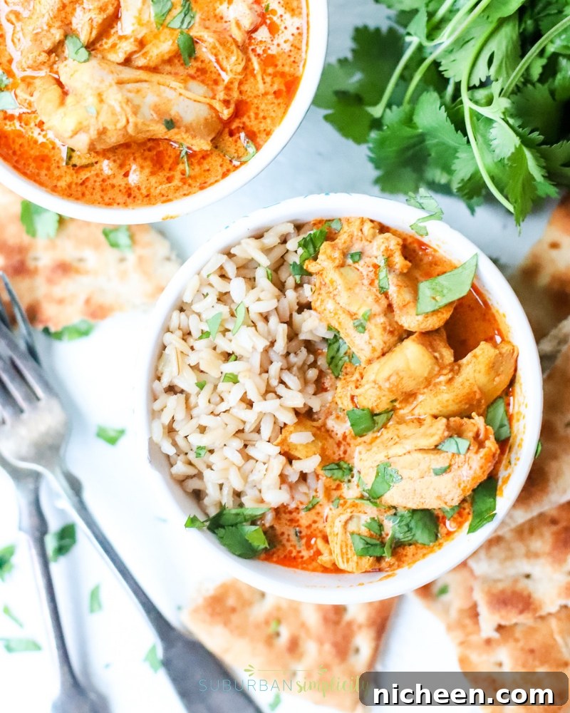 Instant Pot Butter Chicken in bowls with rice with forks laying next to them