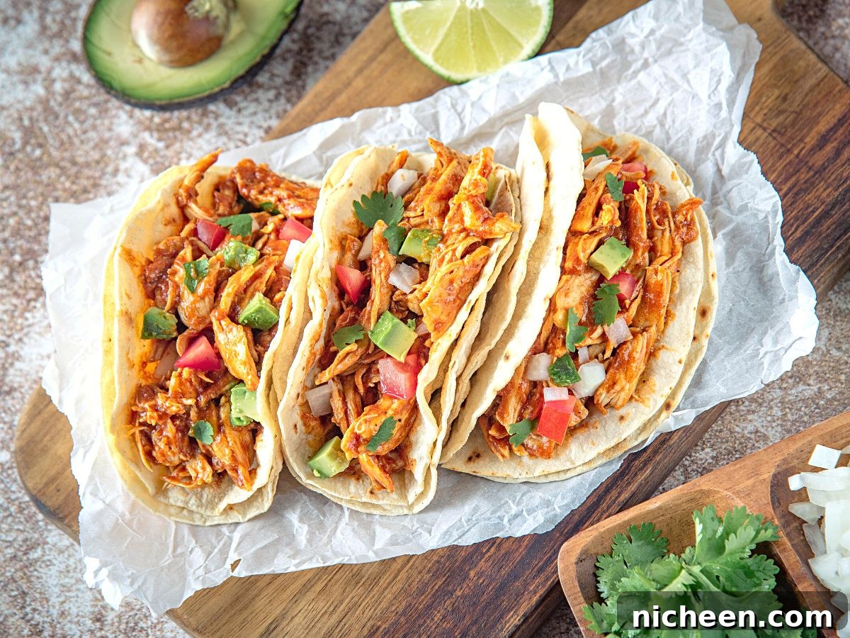 How to Freeze and Store Cooked Shredded Chicken 3 chicken tacos on a counter