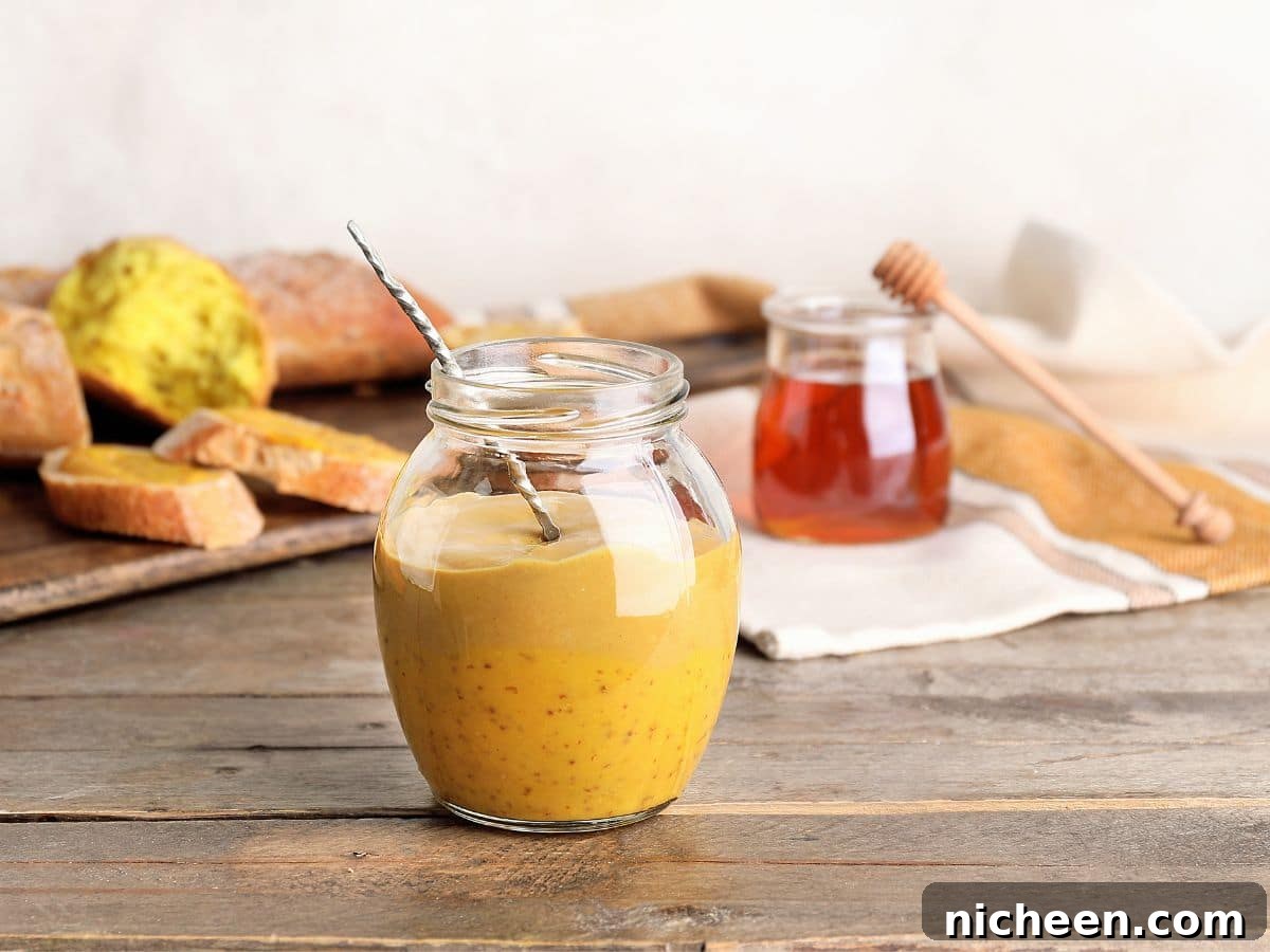 15 Irresistible Dipping Sauce Recipes for Chicken Tenders 6 Honey Mustard dipping sauce in a jar.