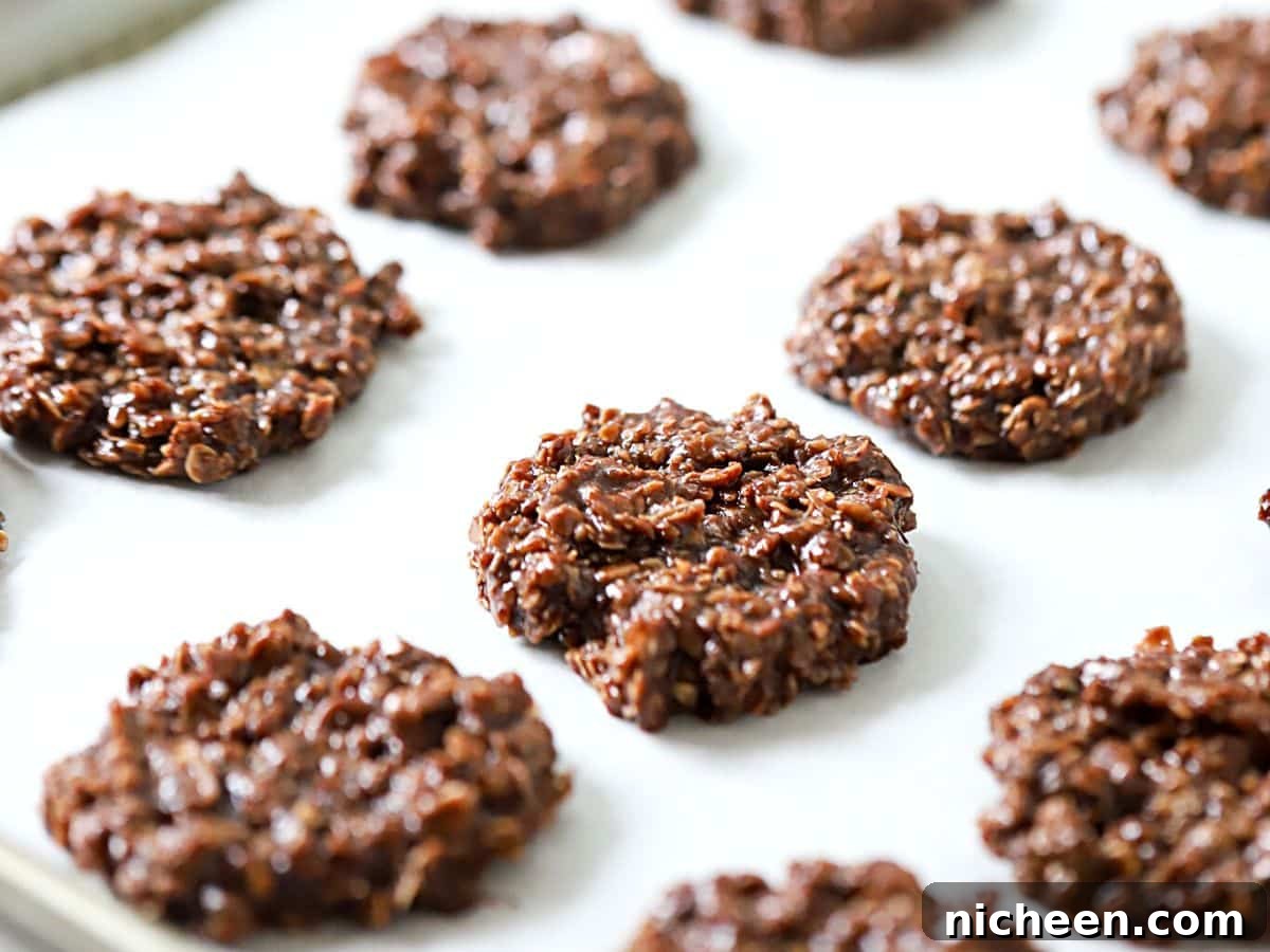 Peanut-Free No-Bake Chocolate Oat Cookies 8 no-bake cookies on a baking sheet.
