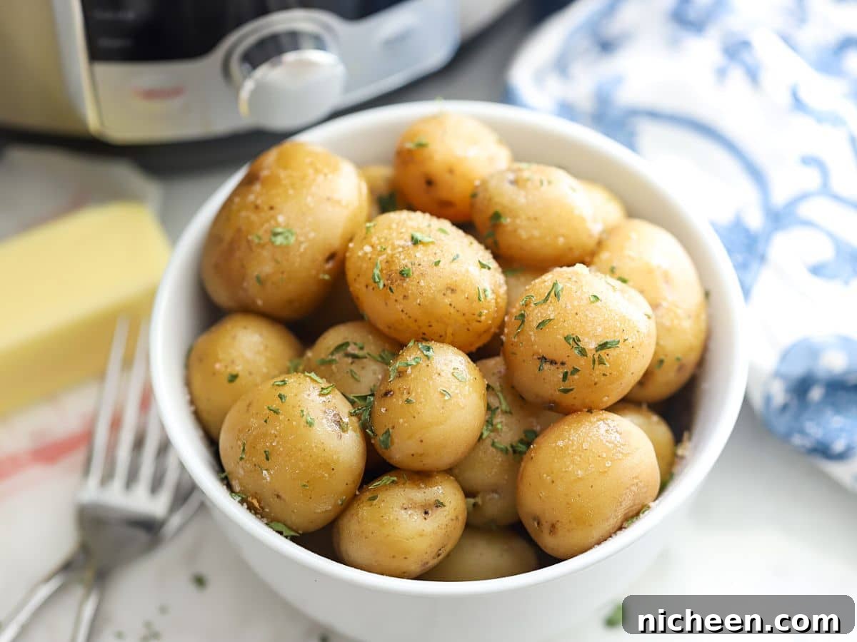 Instant Pot Baby Potatoes with Garlic and Herbs 2 Cooked instant pot potatoes in a bowl.