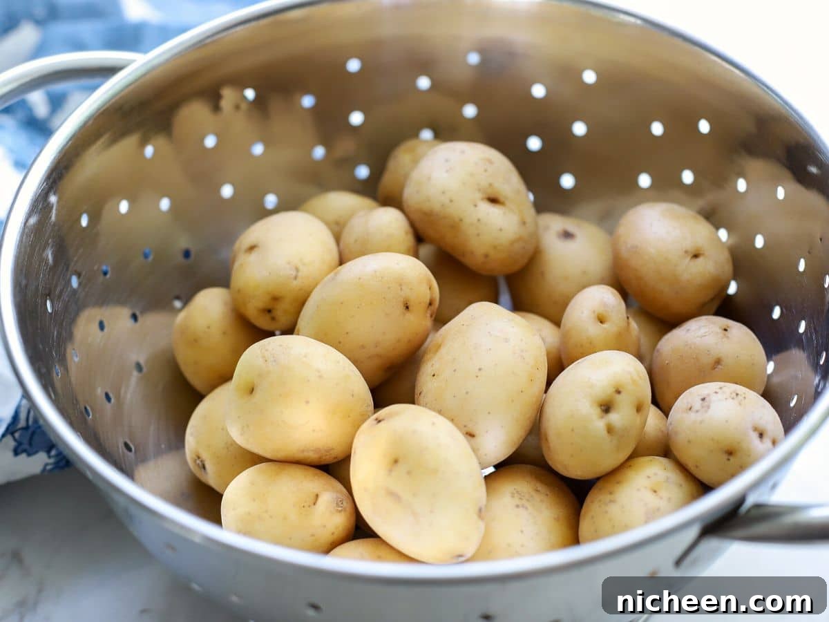 Instant Pot Baby Potatoes with Garlic and Herbs 3 Washed baby potatoes in a strainer.
