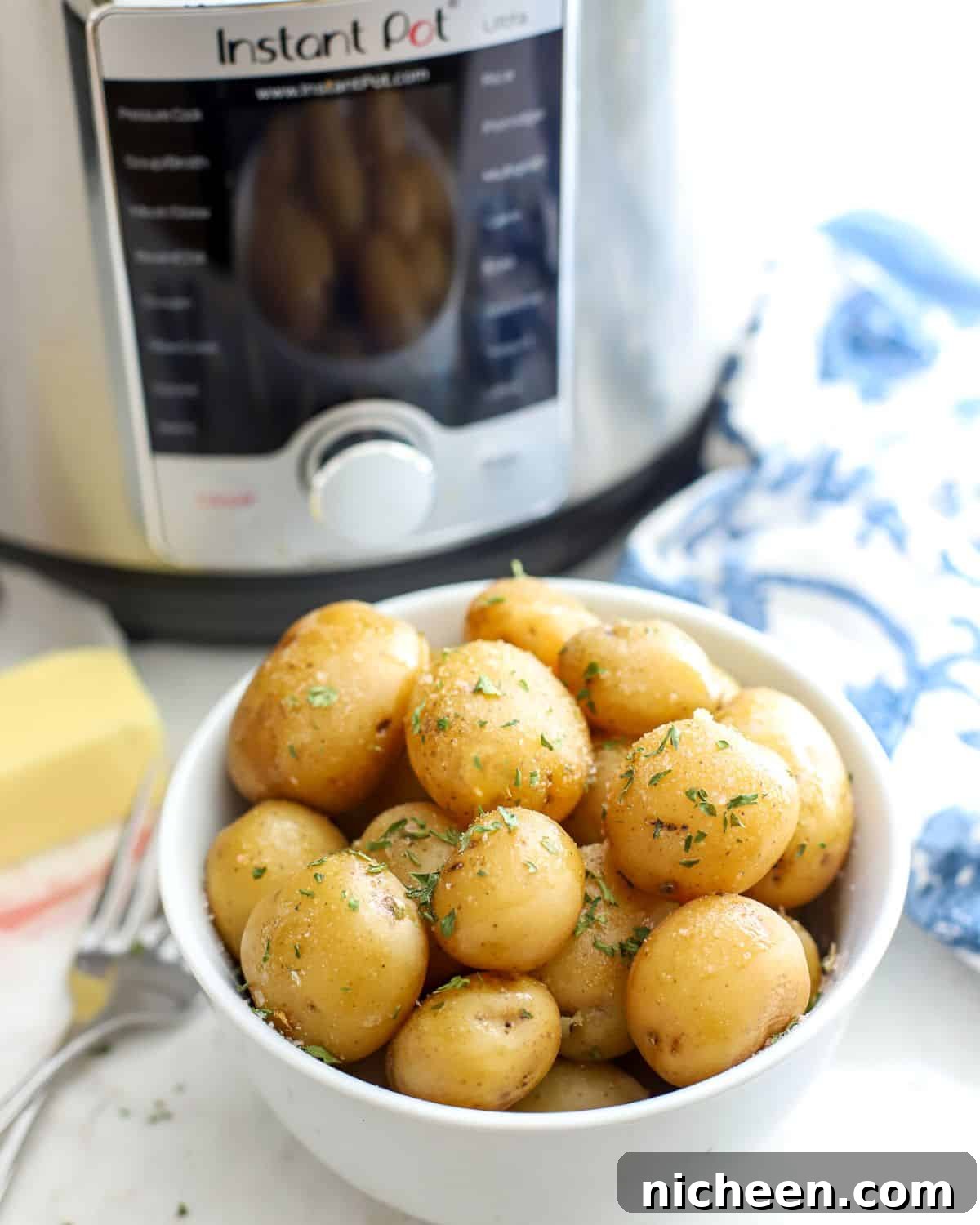 Instant Pot Baby Potatoes with Garlic and Herbs 8 Baby Potatoes in a bowl.