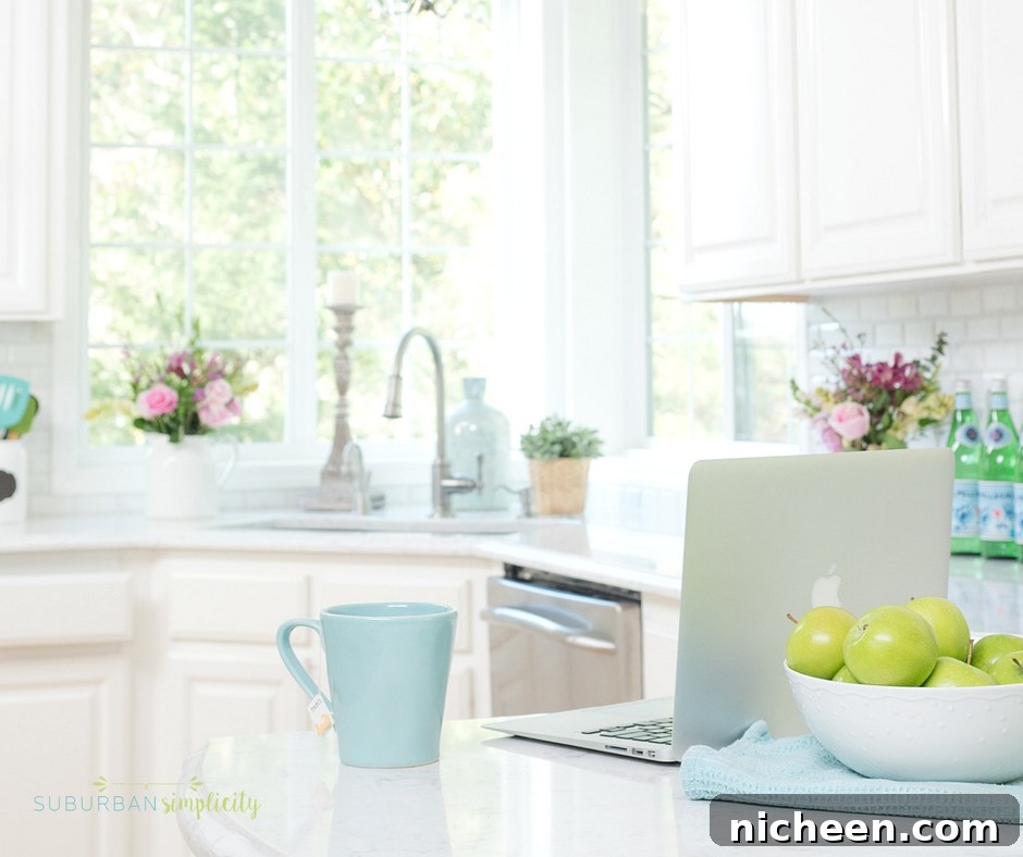 Kitchen with a computer and cup of tea on the counter