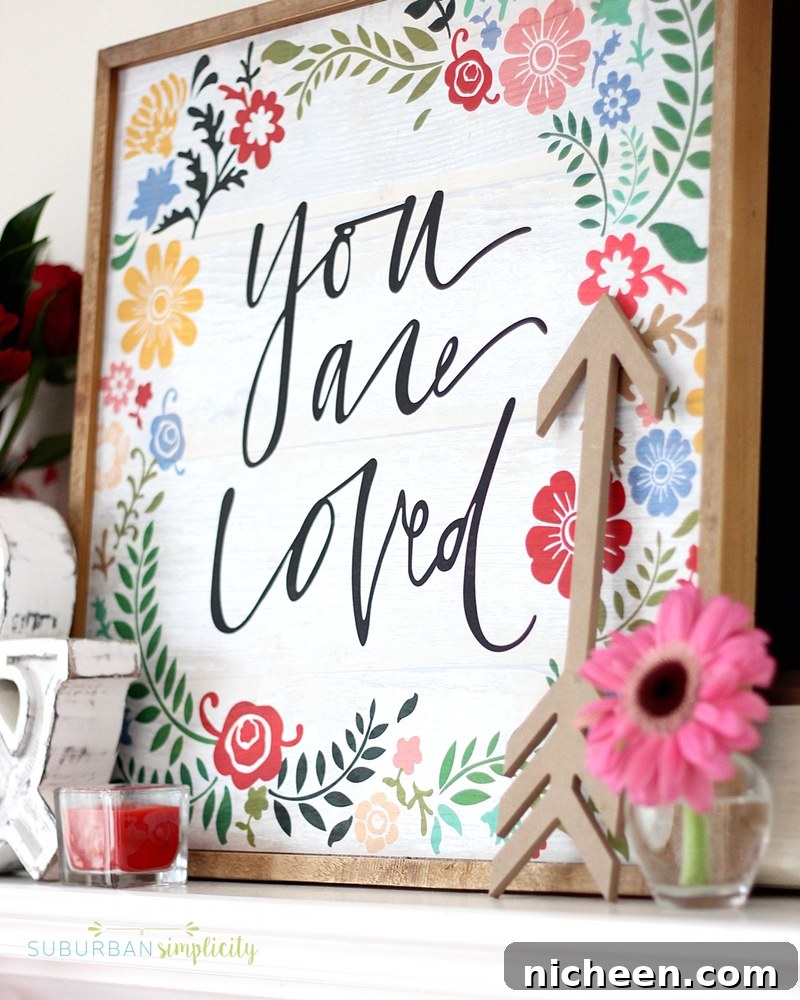 Mantel with candles, flowers, and a handwritten sign for Valentine's Day