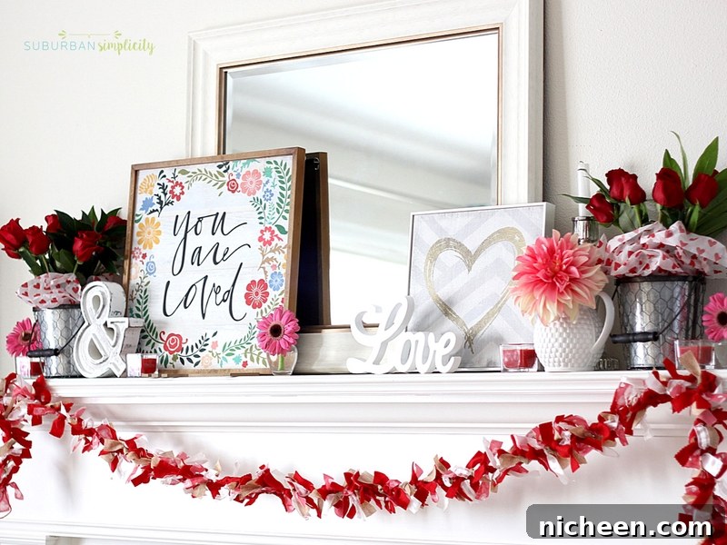 Layered Valentine decorations on a mantel including signs and flowers