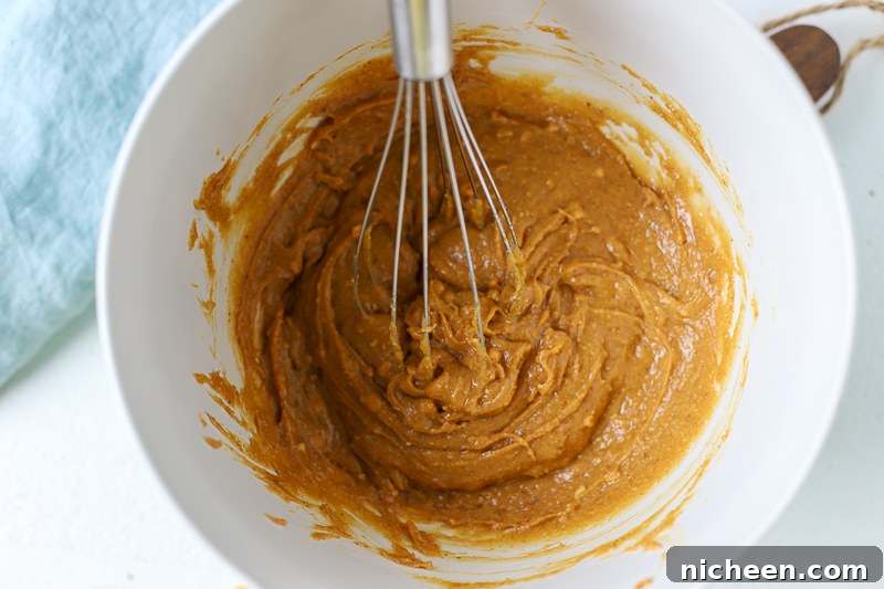 Mixing ingredients for peanut butter cookies with no gluten