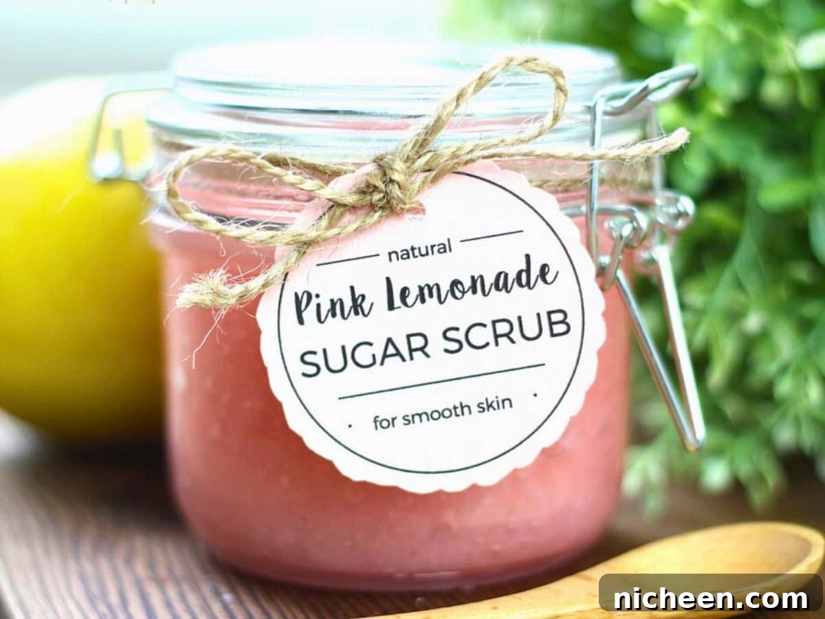Homemade Pink Lemonade Sugar Scrub Recipe 2 A jar of sugar scrub with a printable label attached.