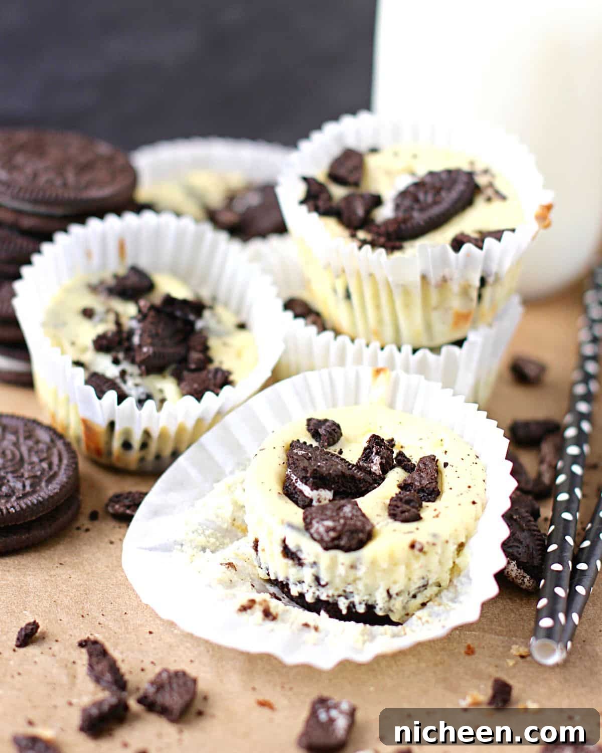 Mini Oreo Cheesecakes Recipe 6 Mini Oreo cheesecakes with crushed Oreos on top.