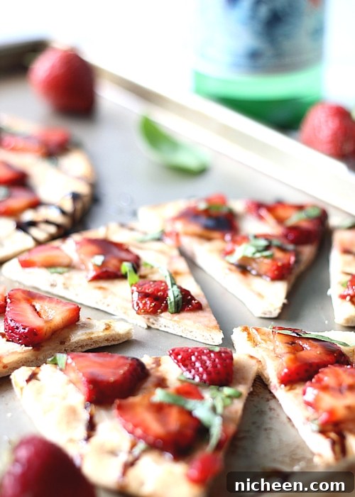 Strawberry Balsamic Flatbread is an easy recipe with lots of sweet and savory flavors. The perfect summer appetizer or snack!