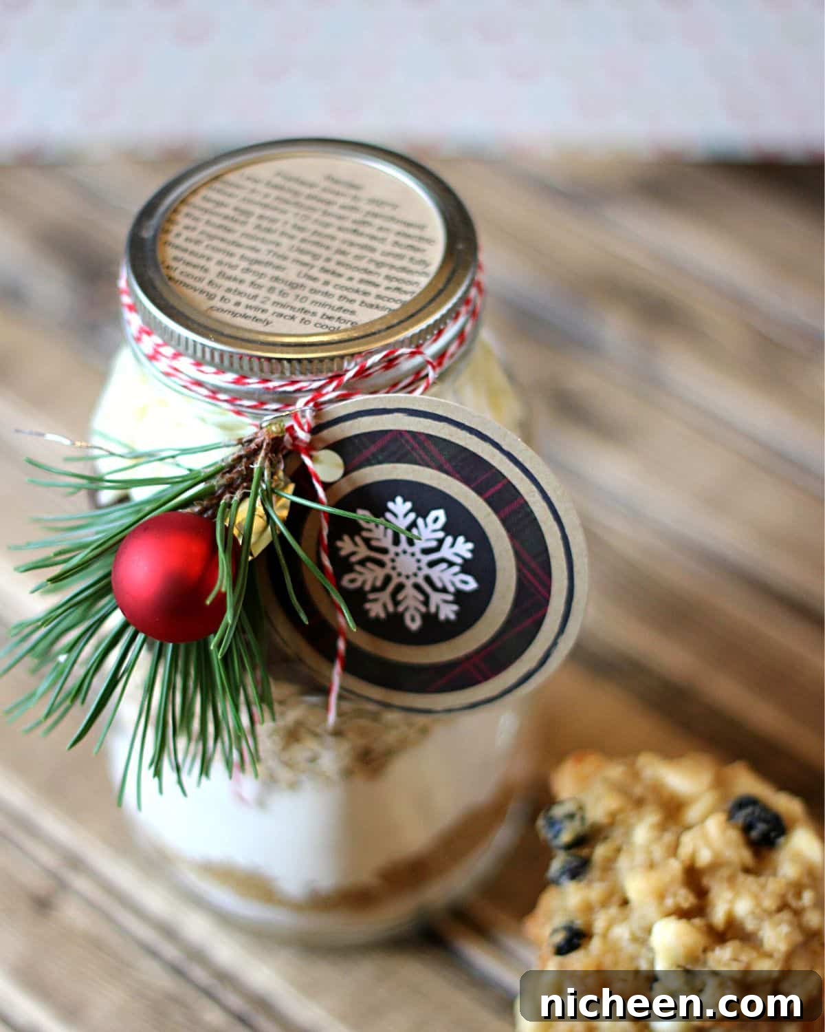 Mason jar with cookie ingredients layered inside.