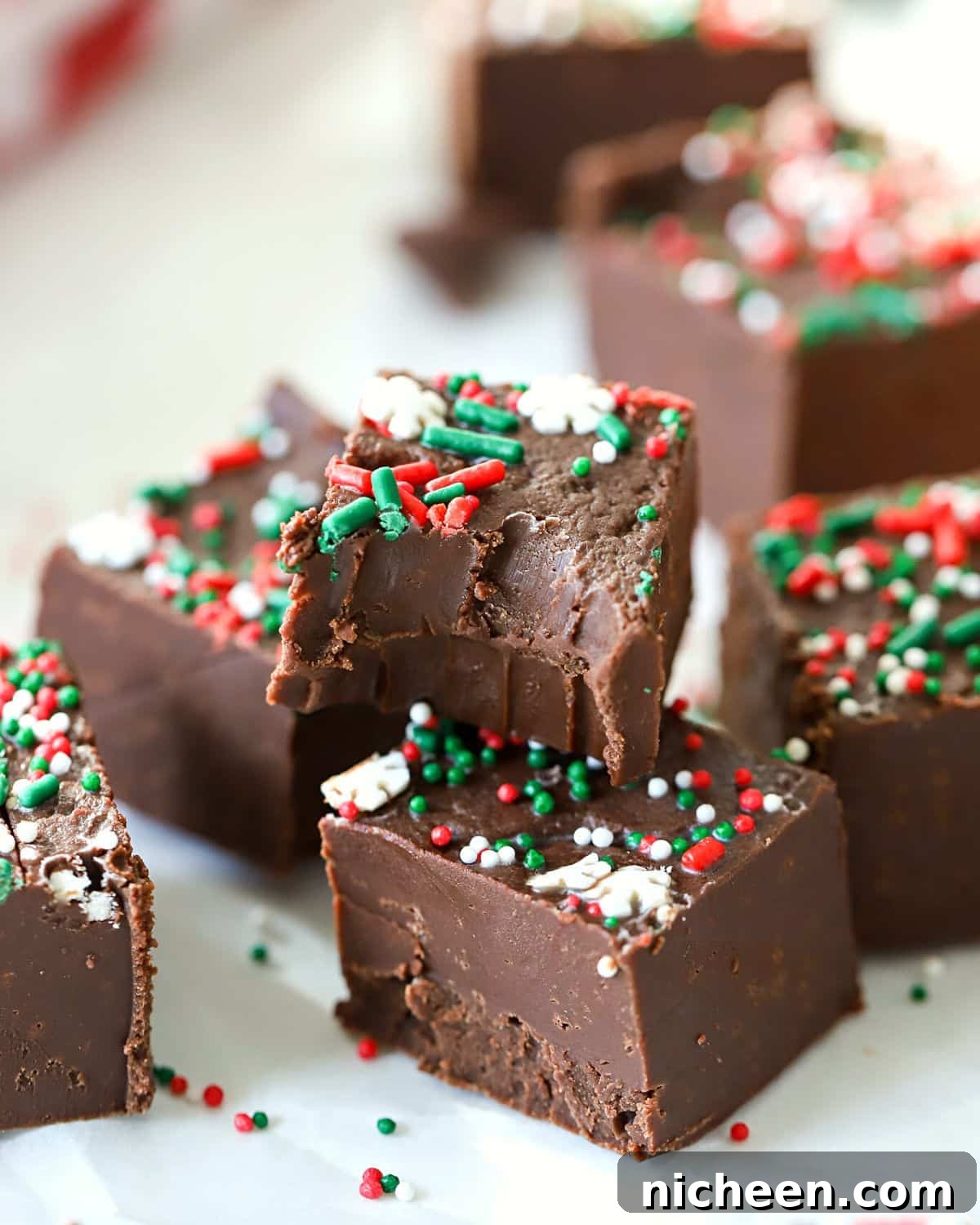 A piece of fudge with a bite out.