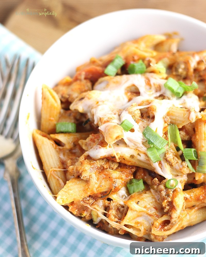 Crockpot Pizza Casserole is an easy weeknight dinner everyone LOVES! Simple and delicious every time. It's even great leftover for lunch the next day!