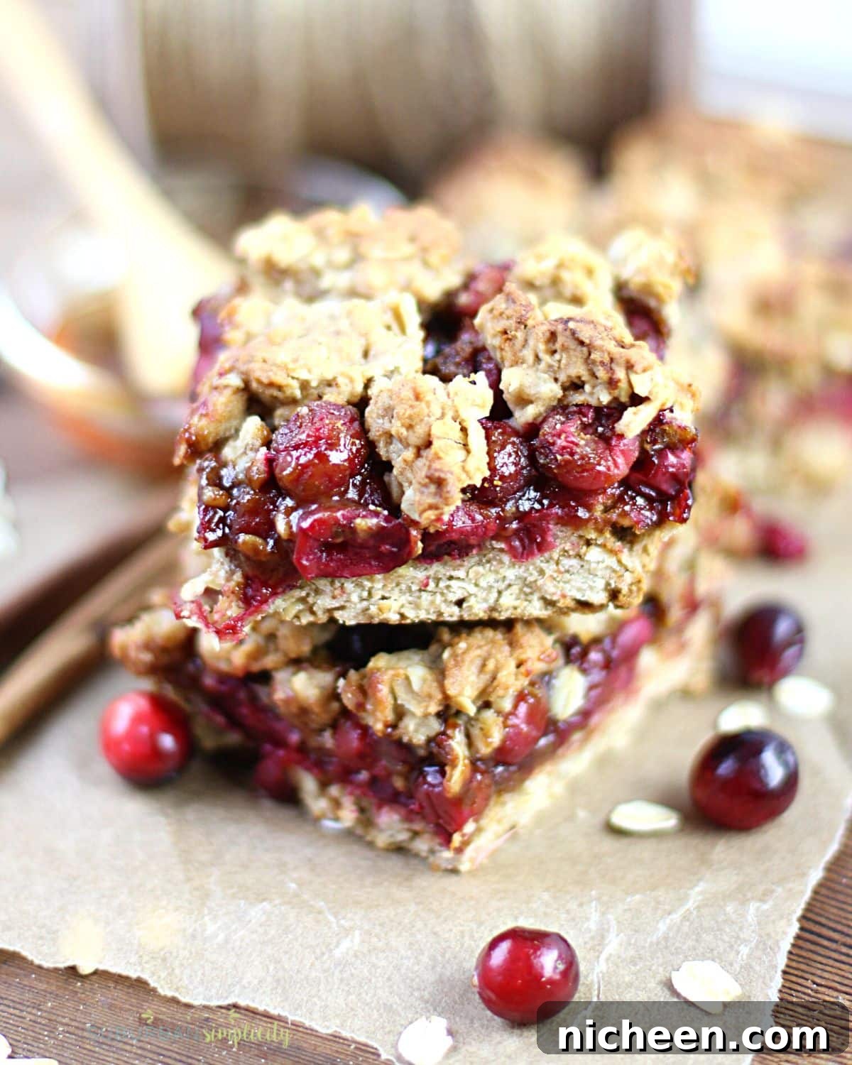 Homemade Cranberry Oatmeal Bars Recipe 2 Cranberry oat bars stacked on top of each other.